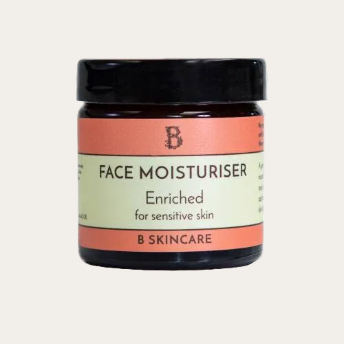 Enriched face moisturiser in a glass jar for dry and sensitive skin.