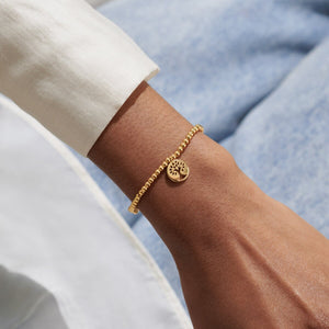 Family gold-plated sentiment bracelet detail