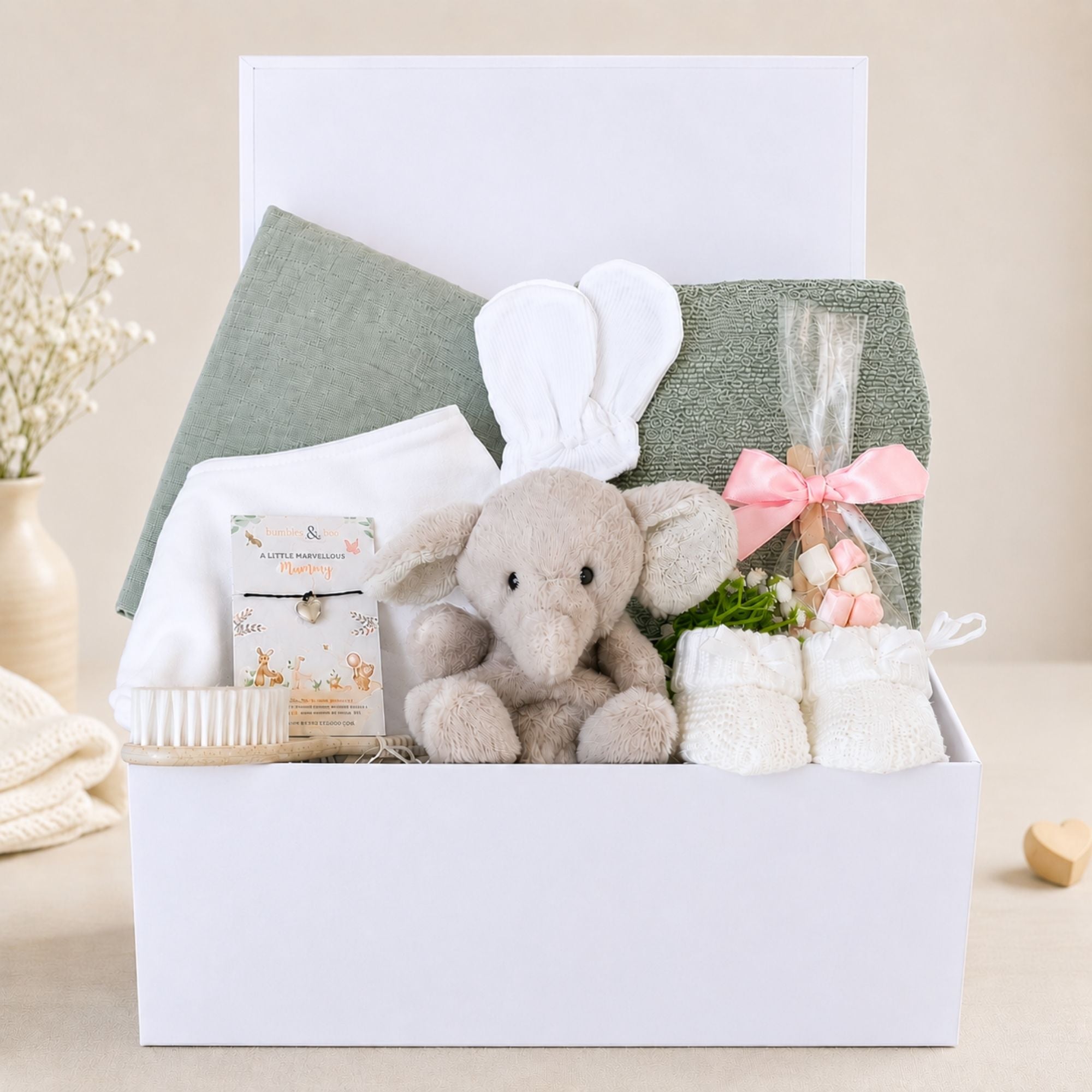 Baby gift box hamper with a little elephant and chocolate stirrer for mum