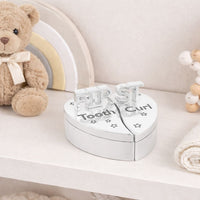 Heart-shaped 'First Tooth Curl' on a trinket
