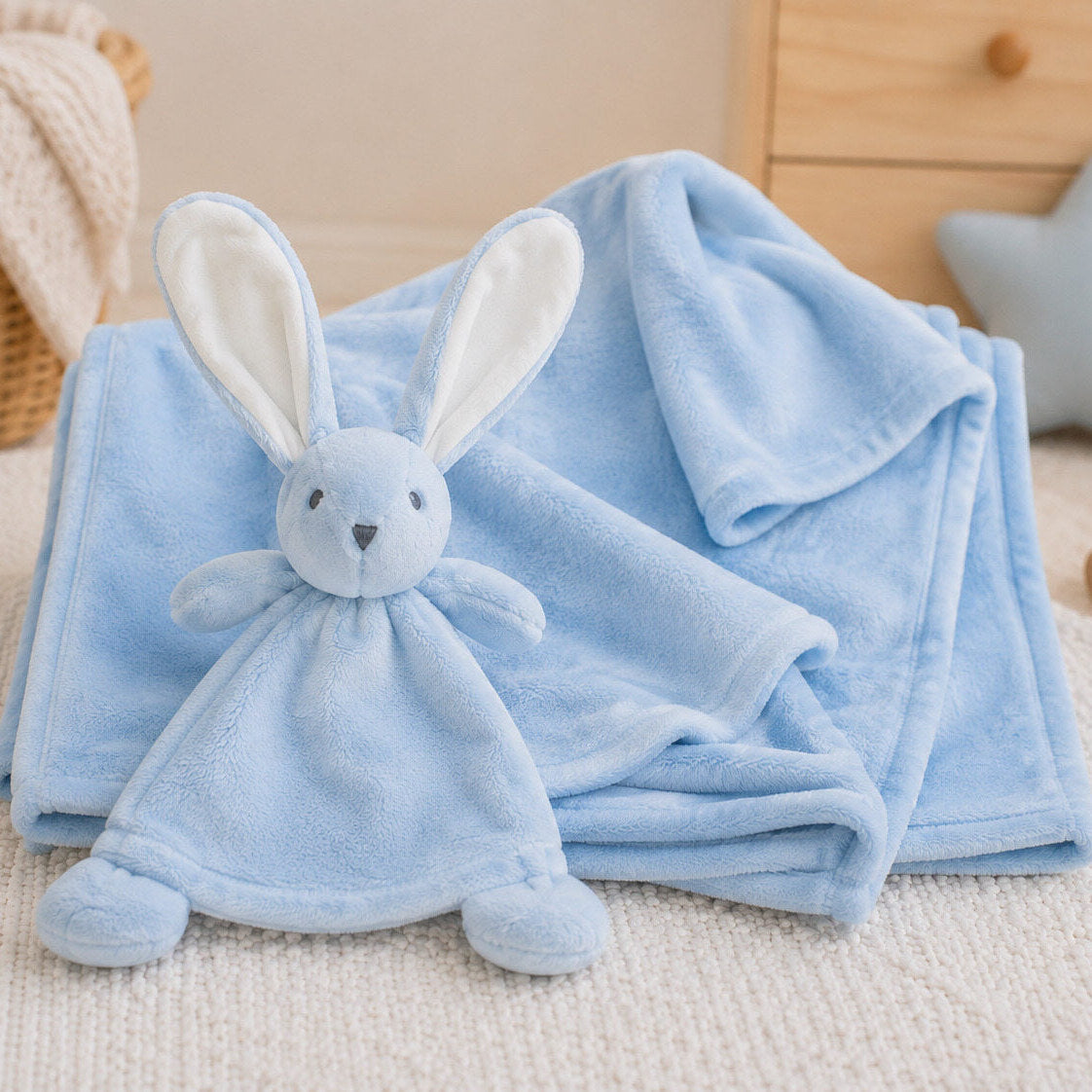 Matching fleece baby blanket and bunny comforter set in light blue