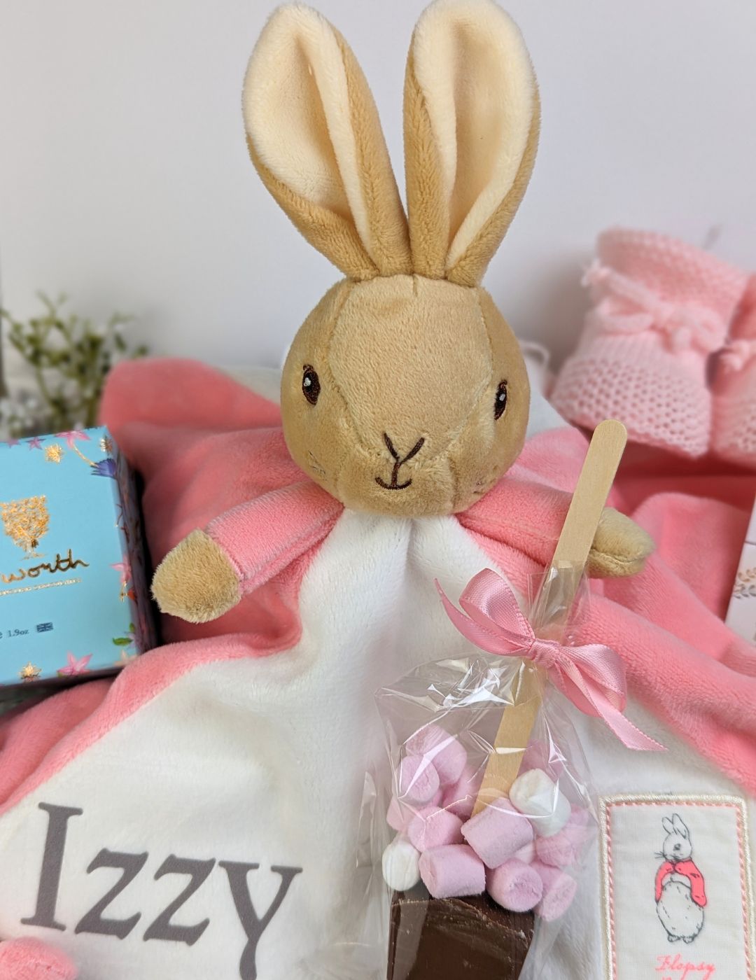 new mum and baby girl gift box with flopsy bunny comforter and chocolates.