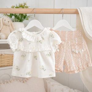 Baby girl floral summer outfit with cream embroidered top and pink gingham shorts, lightweight two piece baby clothes set