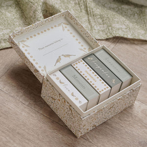 Open floral keepsake box showing organised compartments and write-in lid panel