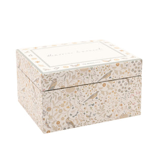Angled closed view of floral cardboard keepsake box against white background