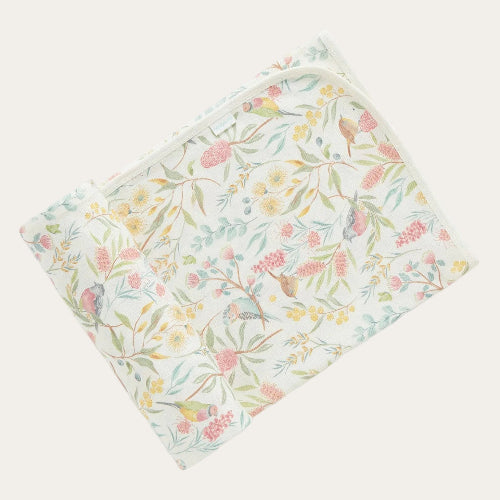 Folded flowery garden organic cotton baby swaddle blanket with Australian flora and fauna print and bound edges. 100cm x 90cm.