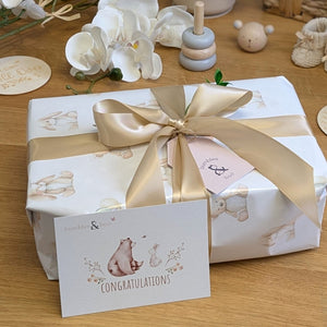 gift wrapping for a present for a new baby