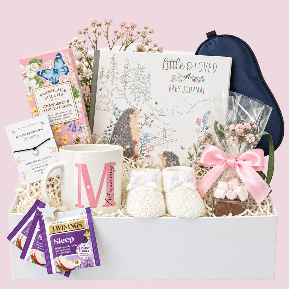 A gift box for a new mum which includes delicious biscuits, a mummy mug and relaxation tea