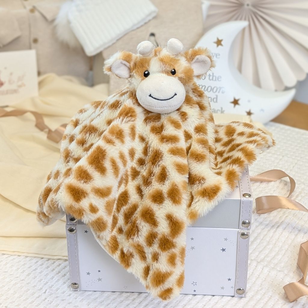 Giraffe-shaped baby comforter plush toy.