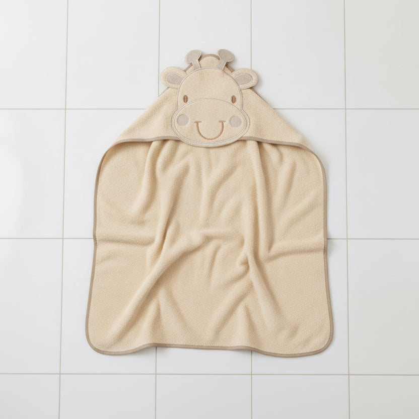 Beige giraffe hooded baby towel laid flat, 100% cotton hooded towel for baby with giraffe face detail, size 75 x 75 cm