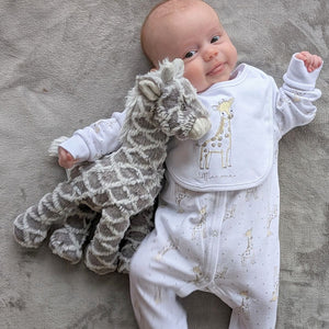 white and grey large giraffe soft toy for a baby