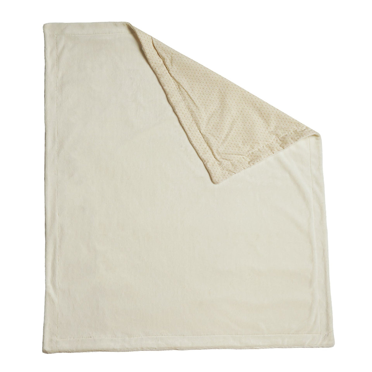 Cream baby blanket alone with its patterned reverse visible at the folded corner.