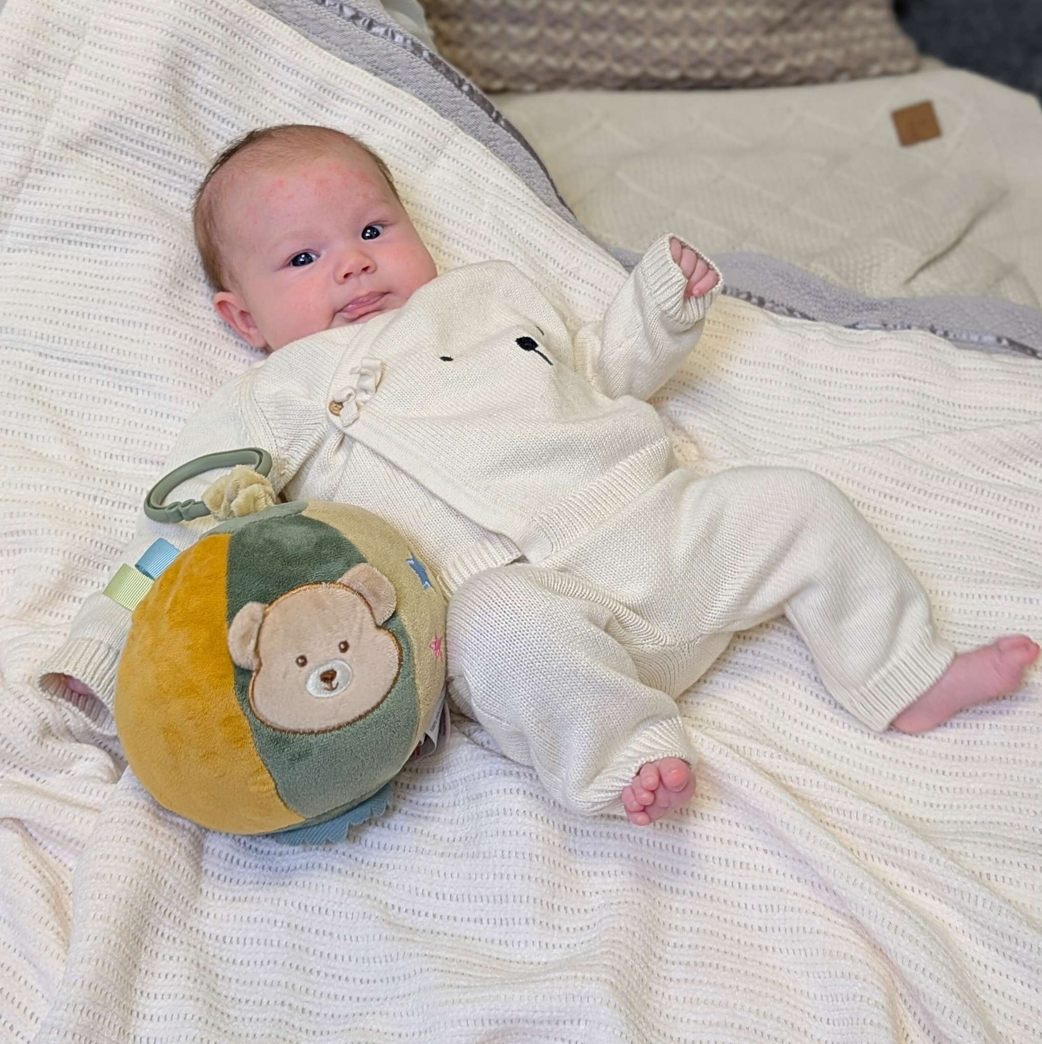 Soft green and beige baby activity ball soft toy