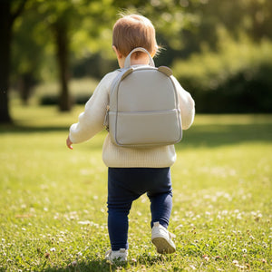 Grey children's backpack with curved top zip fastening and ears by Katie Loxton
