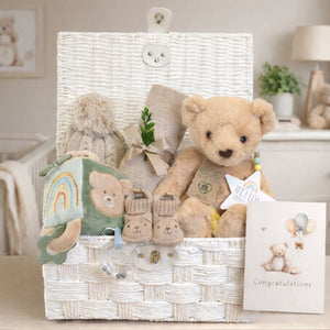 Newborn baby gifts hamper with teddy bear and soft blanket, perfect as a gift for new baby.