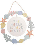 The wooden ring displays a variety of 3D starfish, clam shells and other ocean life for a stylish display. The white wooden plaque inside is decorated with the quote ‘The World Is Your Oyster’ along with a rope hanger so it can be hung on any wall in the home.