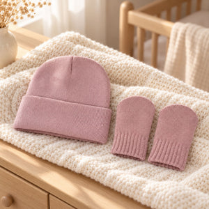 A baby knit hat and matching mittens