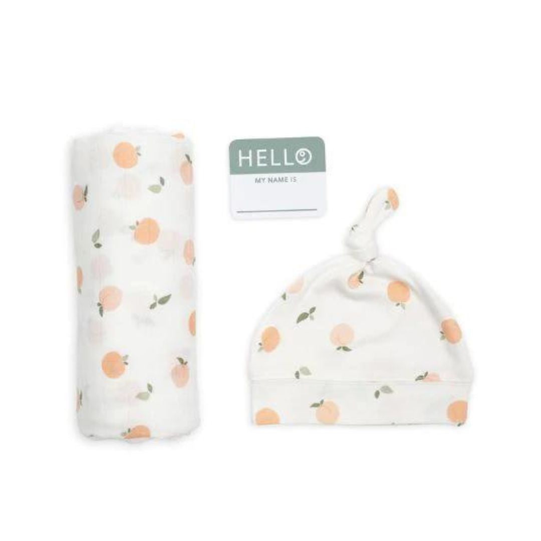Hello world muslin and hat set in soft tones with a peach print