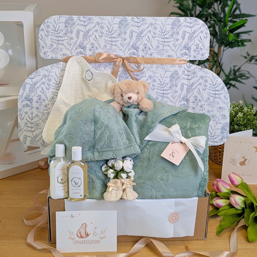 Baby gifts set with teddy bear, blanket and baby wash in a gifts hamper.