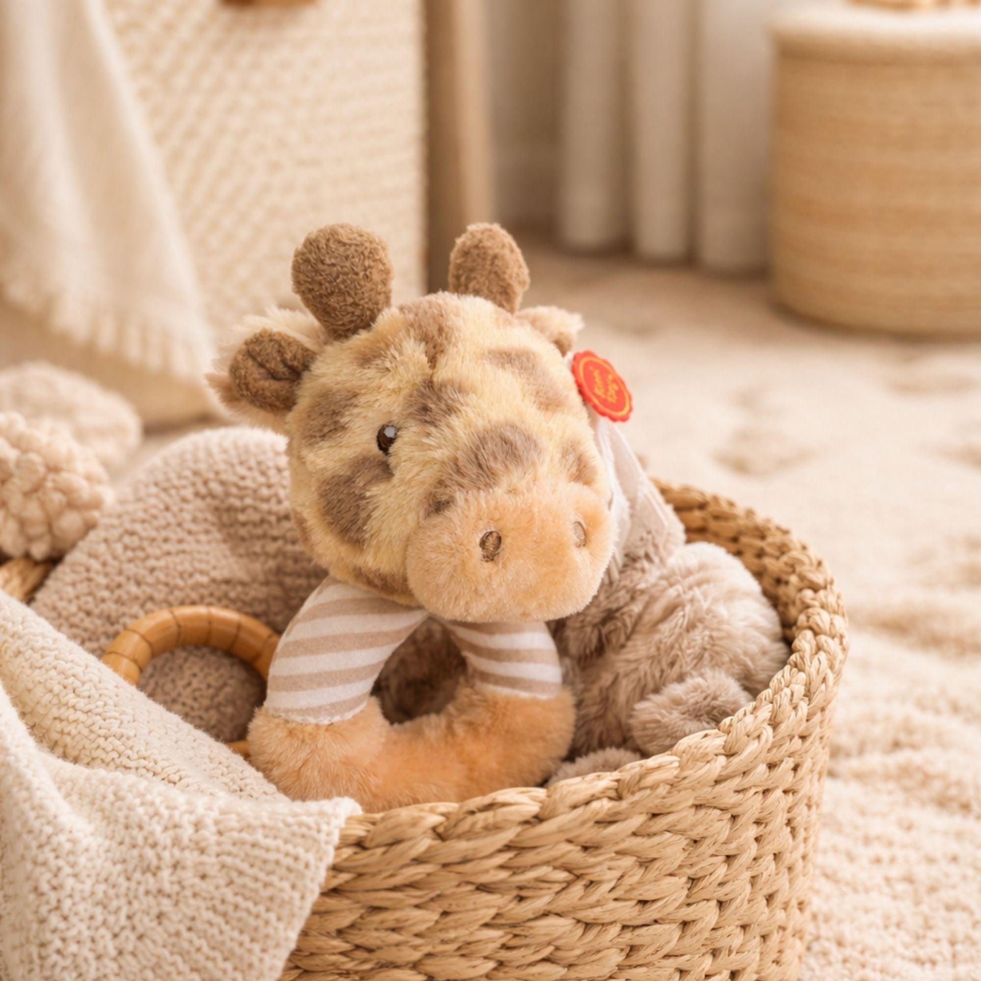 A baby rattle giraffe made from recycled materials