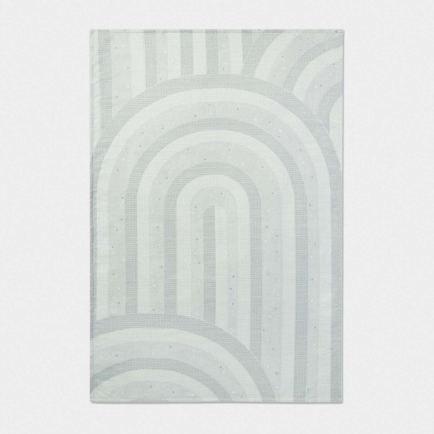 Rectangular rug with a geometric pattern on a light gray background