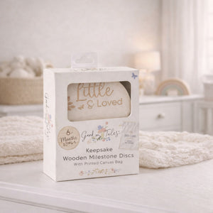 Box of 'Little & Loved' keepsake wooden milestone discs for a baby