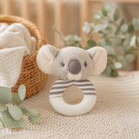 Soft plush koala baby ring rattle toy with a gray face and striped cream and gray ring. 14cm grip toy sized for small hands