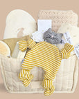 Stunning new baby hamper basket brimming with the finest of baby gifting