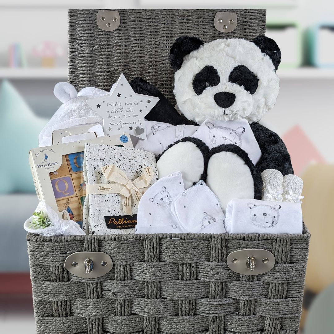 large baby hamper with panda bear, baby bath robe, clothing set and peter rabbit baby blocks.