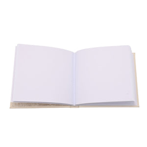 Open baby photo album displaying plain white pages