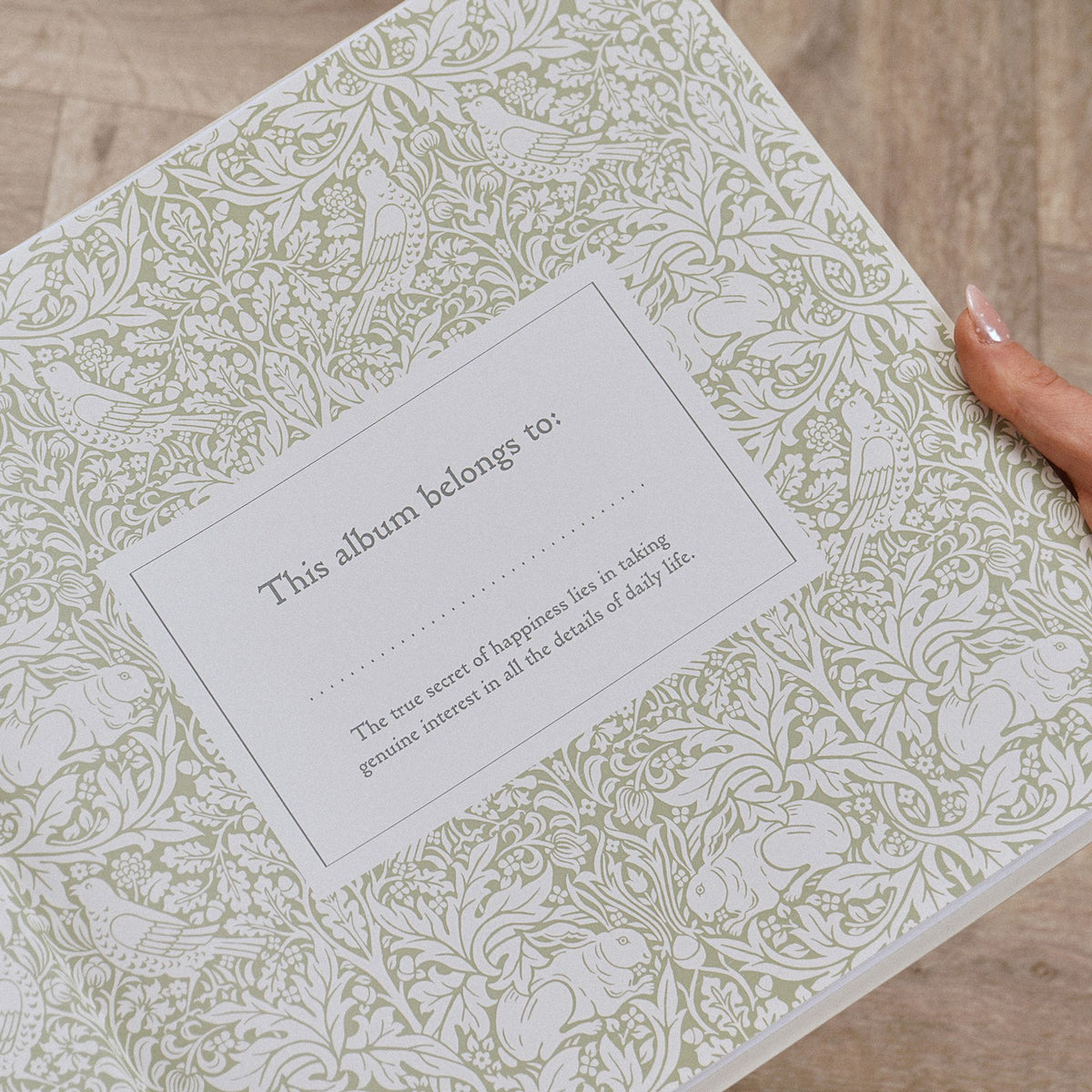 Close-up of patterned dedication page held open inside the memories album