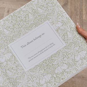 Close-up of patterned dedication page held open inside the memories album