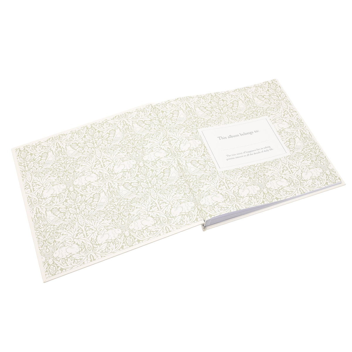 Memories photo album open at decorative floral endpapers