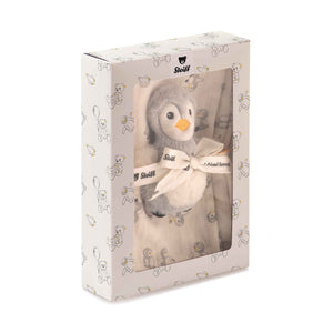 Lio penguin rattle and cotton burp cloth gift set in a windowed presentation box with a ribbon.