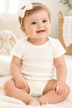 Marshmallow cream 100% cotton ribbed baby bodysuit detail