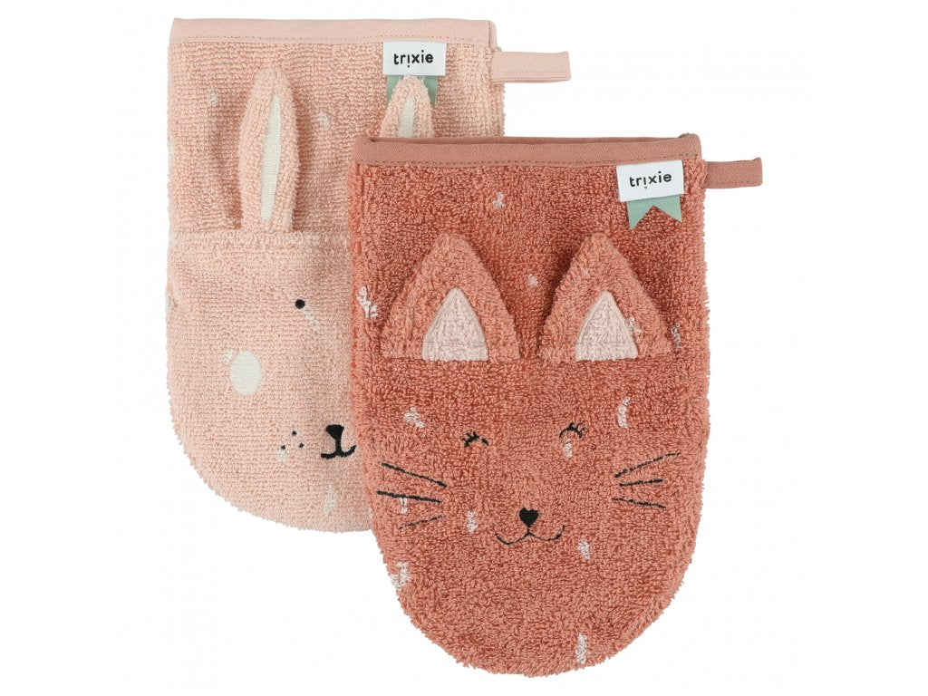 A pink rabbit washcloth and a pink cat washcloth