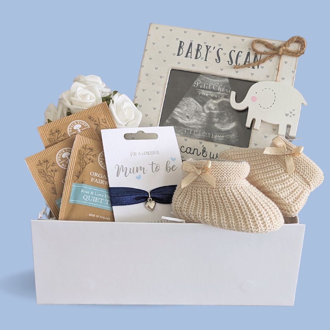 mum to be gifts box with pregnancy scan, baby booties, bracelet and quiet time organic tea. 