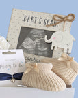 mum to be gifts box with pregnancy scan, baby booties, bracelet and quiet time organic tea. 