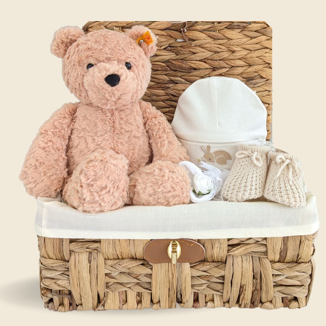Stunning mum to be gifts hamper with Teddy Bear, Organic baby hat, baby booties and baby scratch mittens. In an eco gift basket.