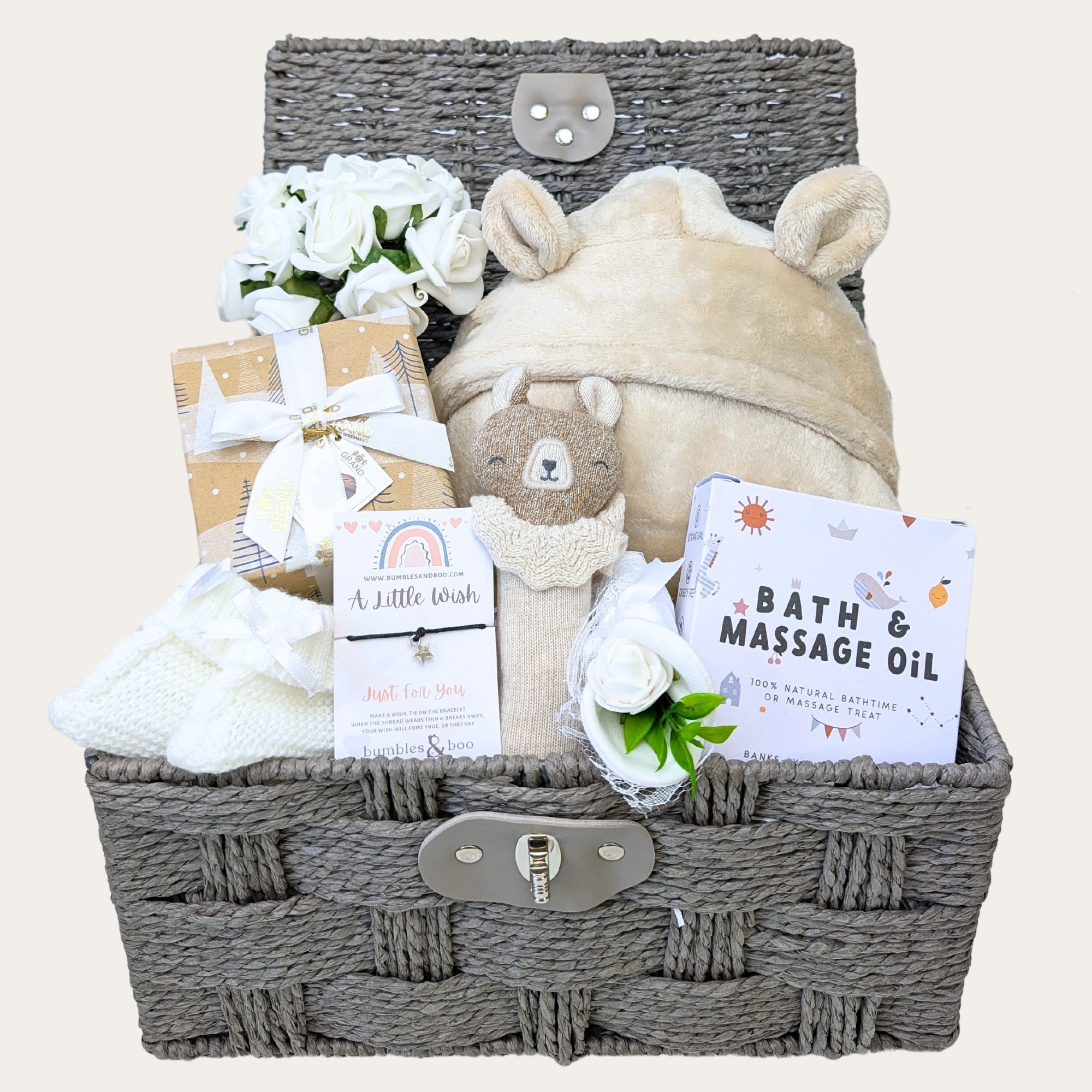 Luxury mum to be gift hamper with teddy bear theme and presents for both mummy and baby in a brown wicker basket 