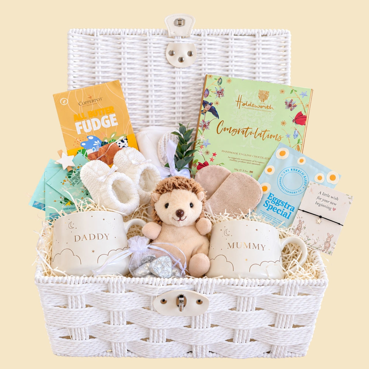 Mum to be gifts hamper with mummy and daddy mugs and sweet treats for the parents to be