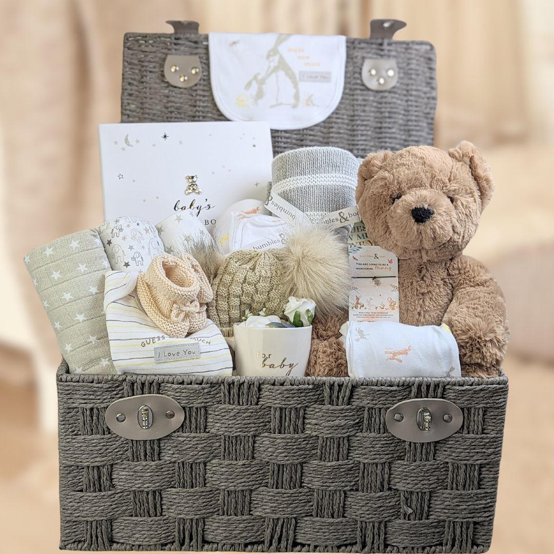 large mum to be hamper with baby clothing, teddy bear, baby journal, muslins and blanket.