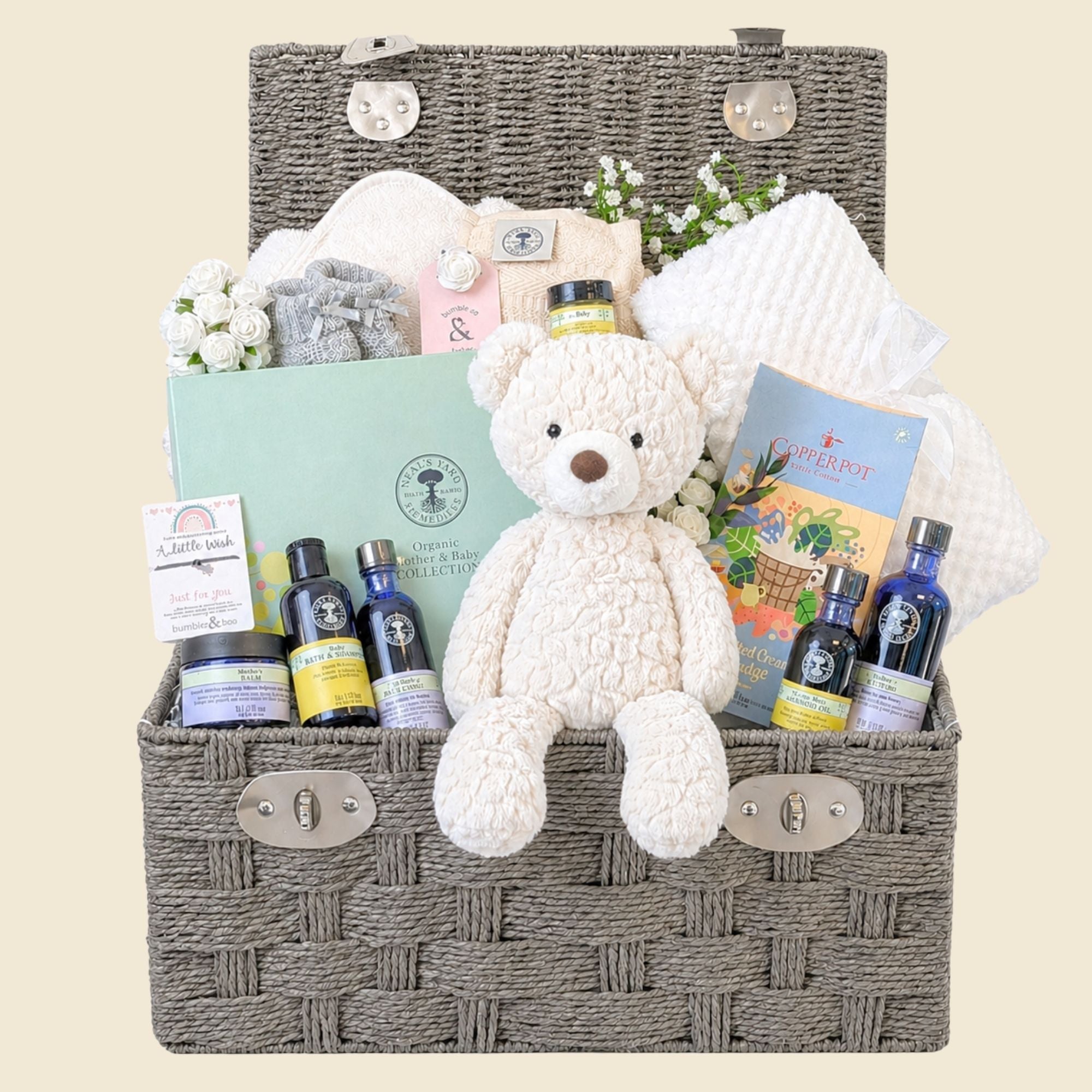 Neals Yard pregnancy gifts hamper basket with mum to be presents including organic skincare and blanket. Bumbles and Boo.