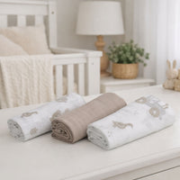 white and beige baby muslin squares