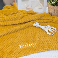 Mustard yellow baby waffle blanket which can be personalised.