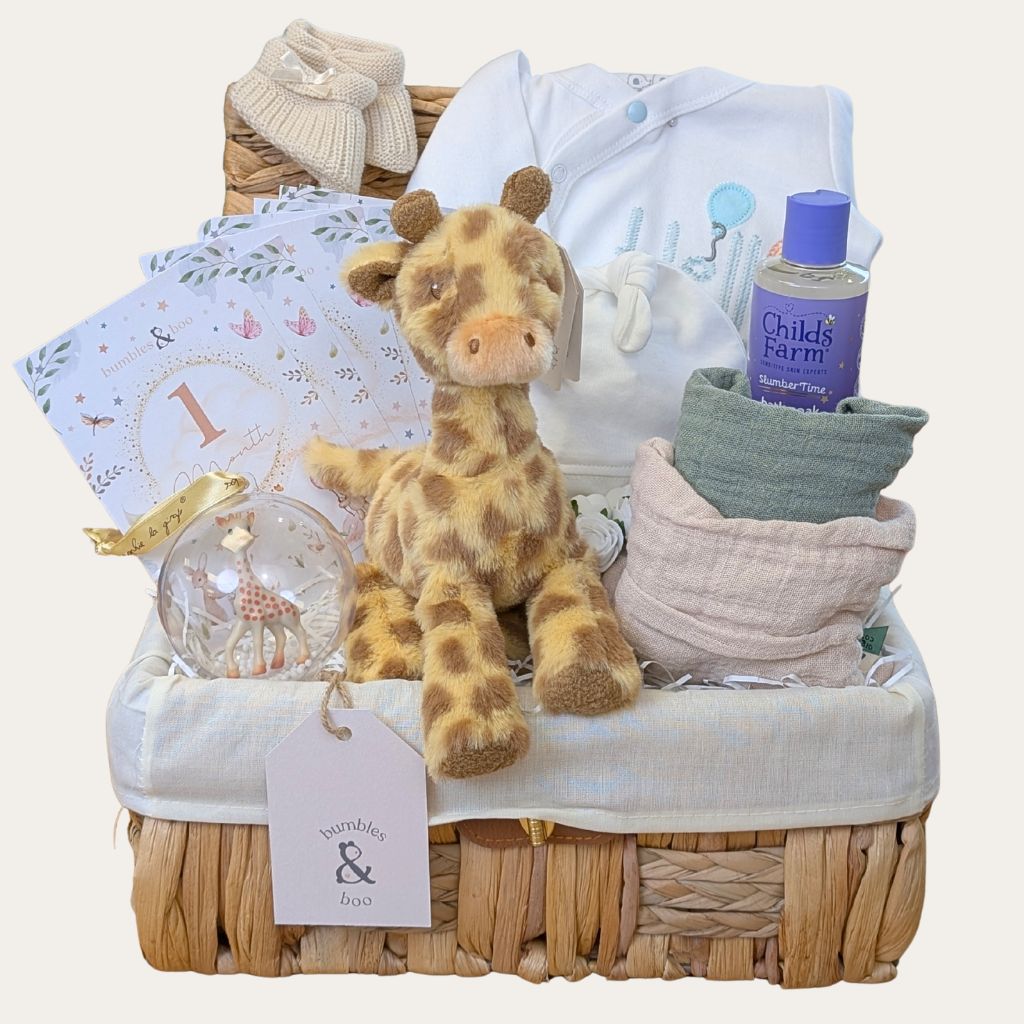Baby gift hamper with plush giraffe, sleepsuit, muslins, baby wash and other presents and gifts. Bumbles and Boo. 