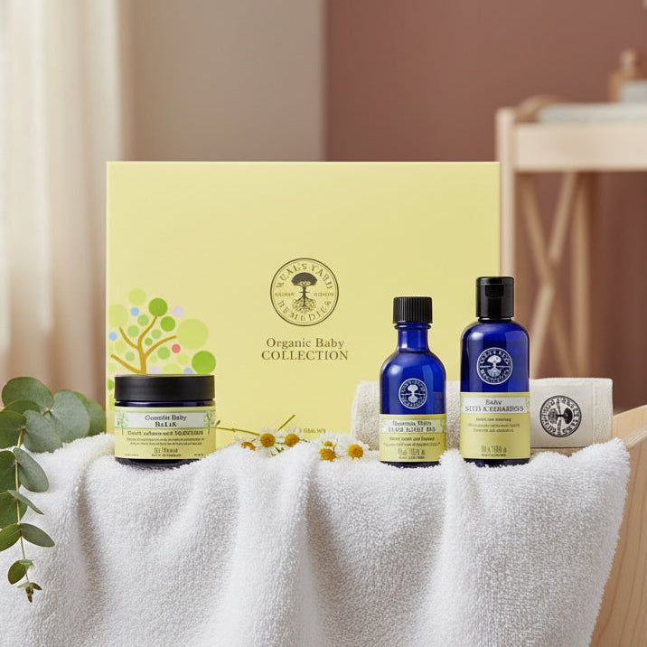 Neal's Yard Remedies organic baby collection. Includes baby oil, baby balm & baby bath & shampoo in a yellow box.