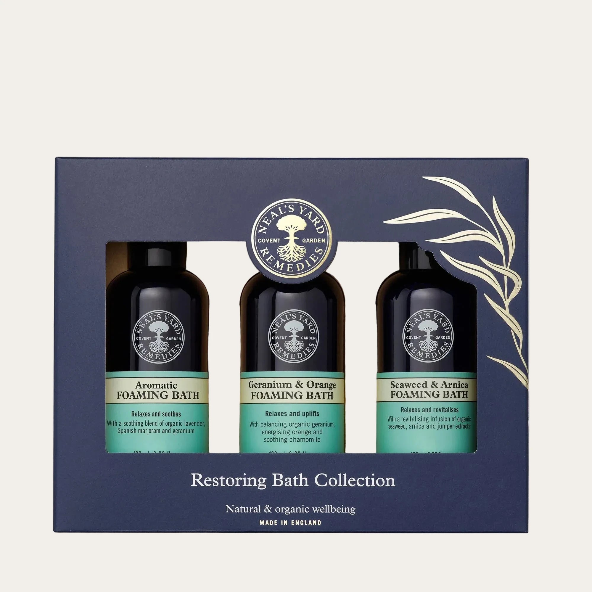 Neal's Yard Restoring Bath Collection with three foaming bath bottles on a white background

