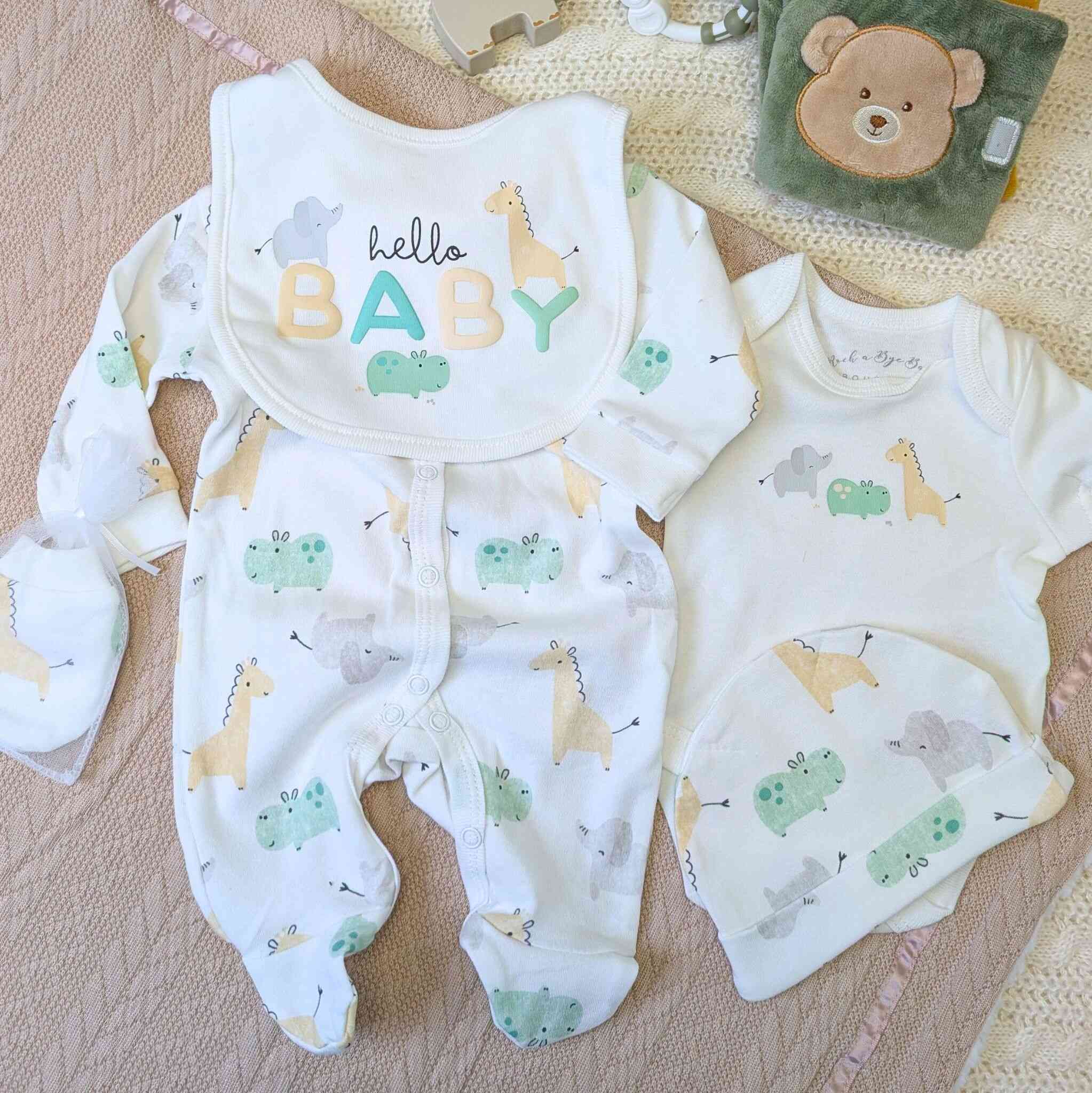 Baby clothing gift set with safari animals in green and yellow.