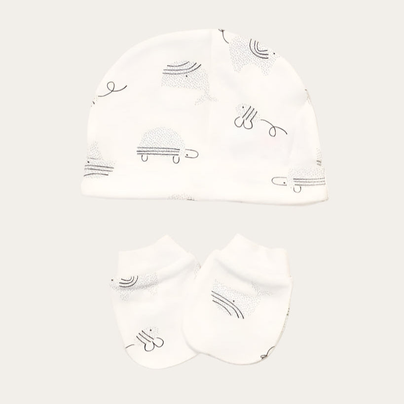 Baby hat and scratch mitts in white with grey animal pattern.